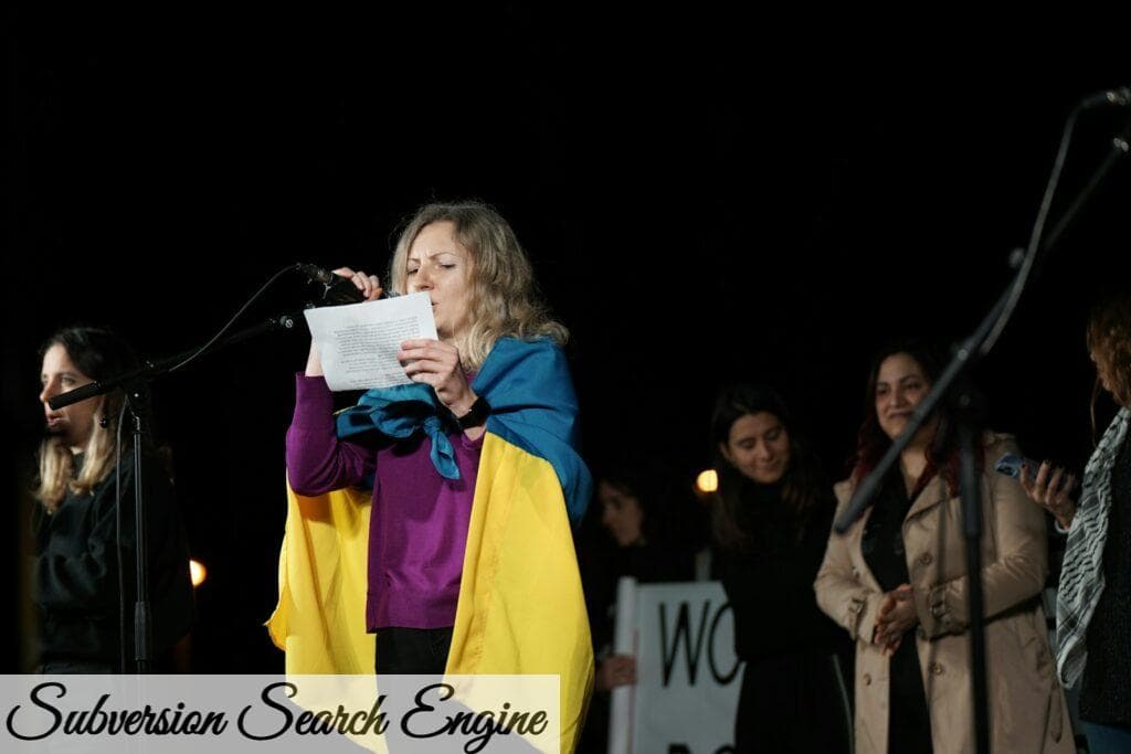 a woman standing in front of a microphone holding a piece of paper
