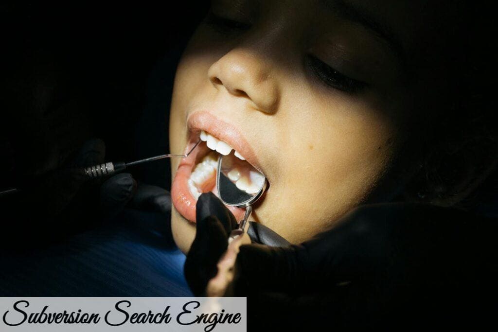 Close-up of a child undergoing a dental examination at a clinic.
