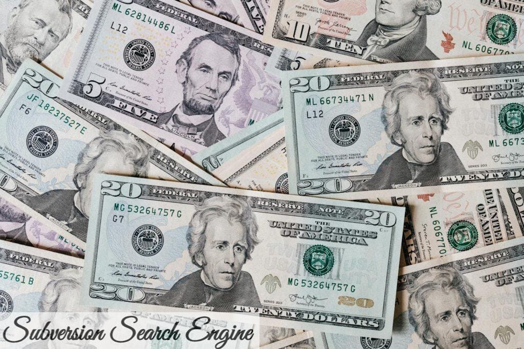 Top view of different types and colors American dollars placed together on each other
